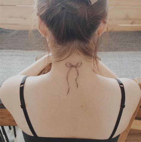 neck bow tattoo|large bow tattoos.